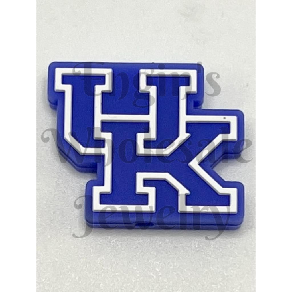 Blue and white 'UK' logo on a textured gray background