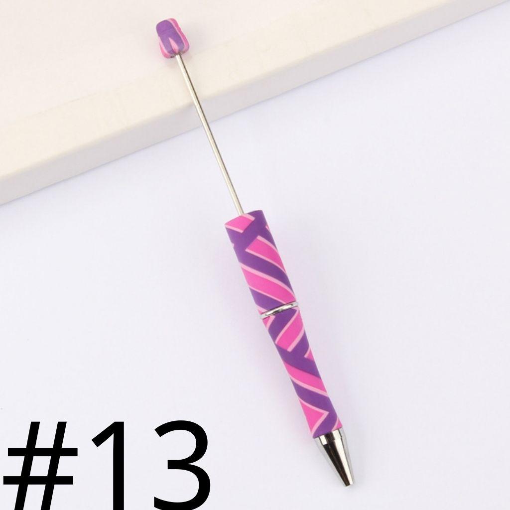 Pink and purple striped pen on a white background with the number 13 displayed.