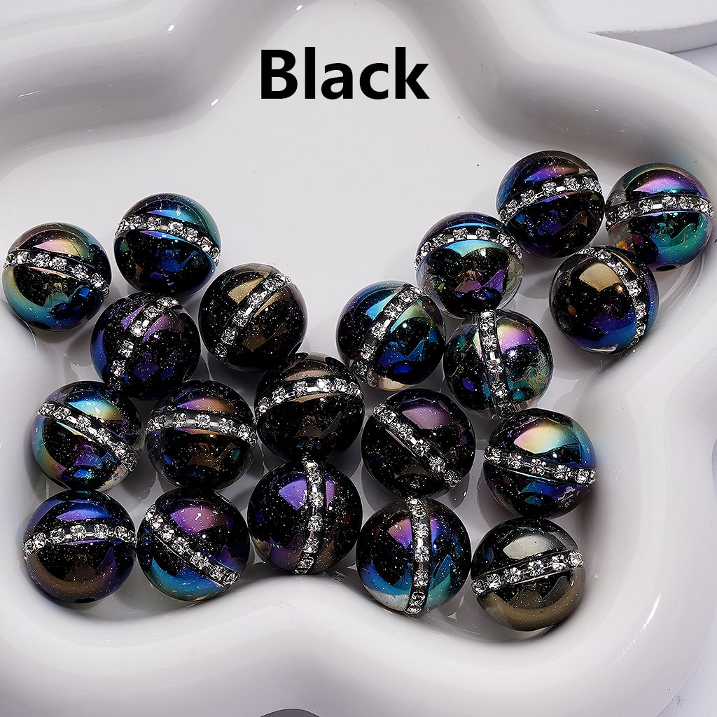 Black beads with metallic sheen on a white dish