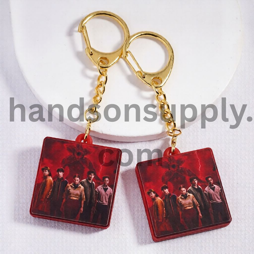 Flat Square Shape Metal Keychain with Gold Lobster Pendant Charm Clasp Red Background Design Horror Style