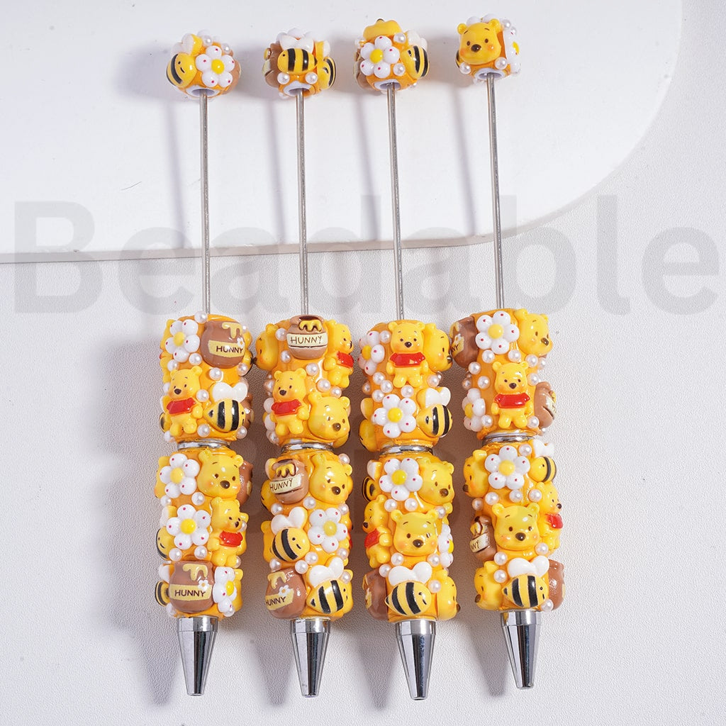 Set of decorative pens with cartoon character designs on a white background