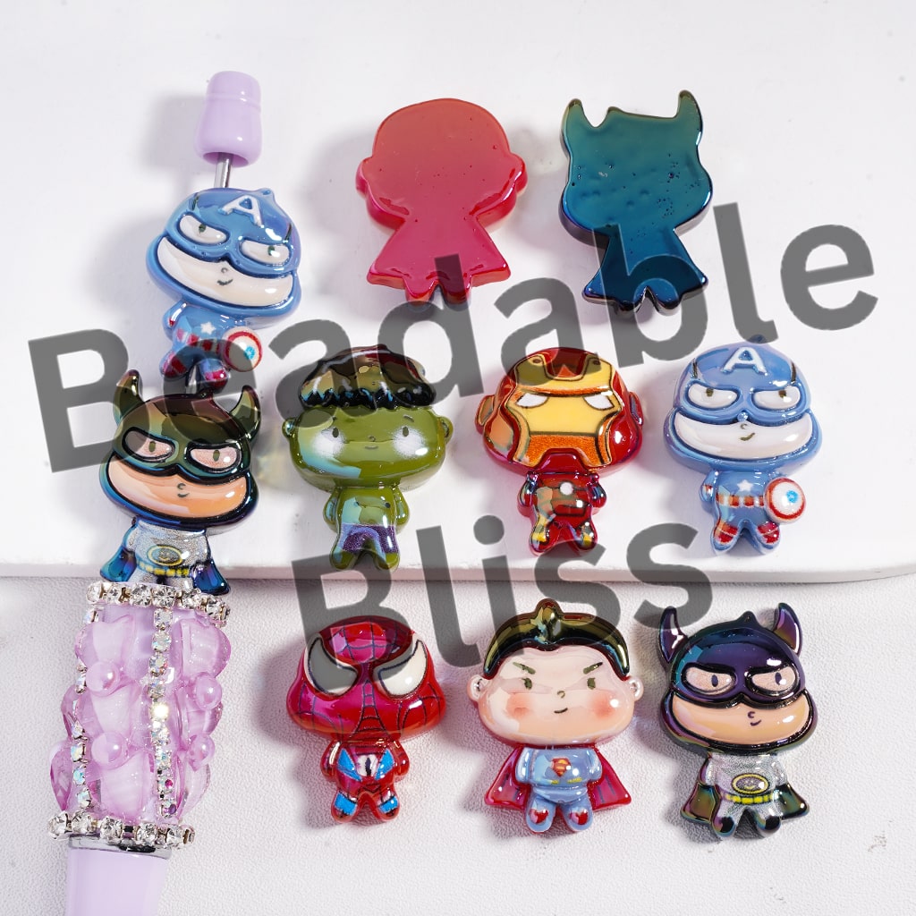 Set of colorful character charms on a white background