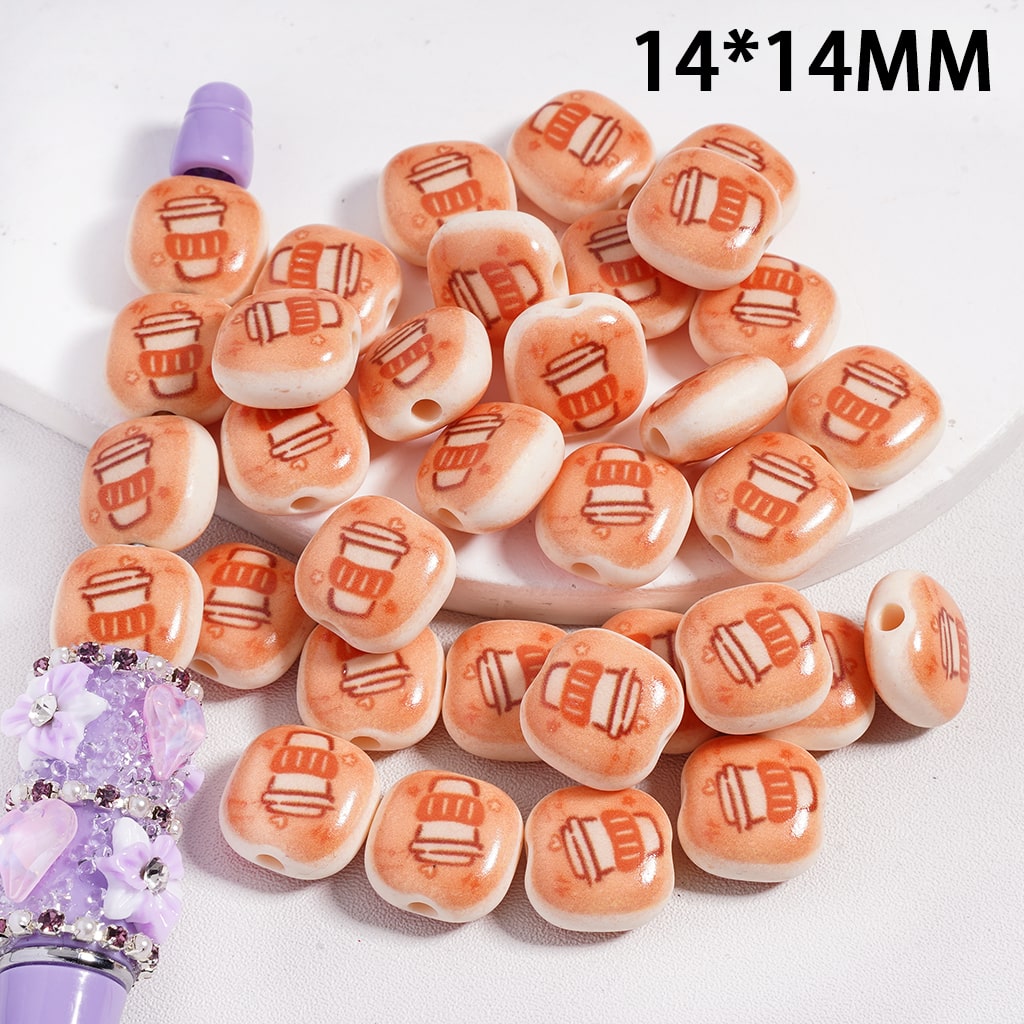 Peach-colored beads with coffee cup design on a white background