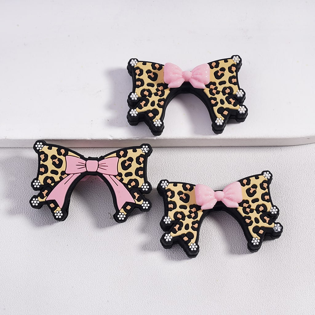 Glittery Pink Bowtie over a Bigger Bowtie and White Flowers Silicone Focal Beads
