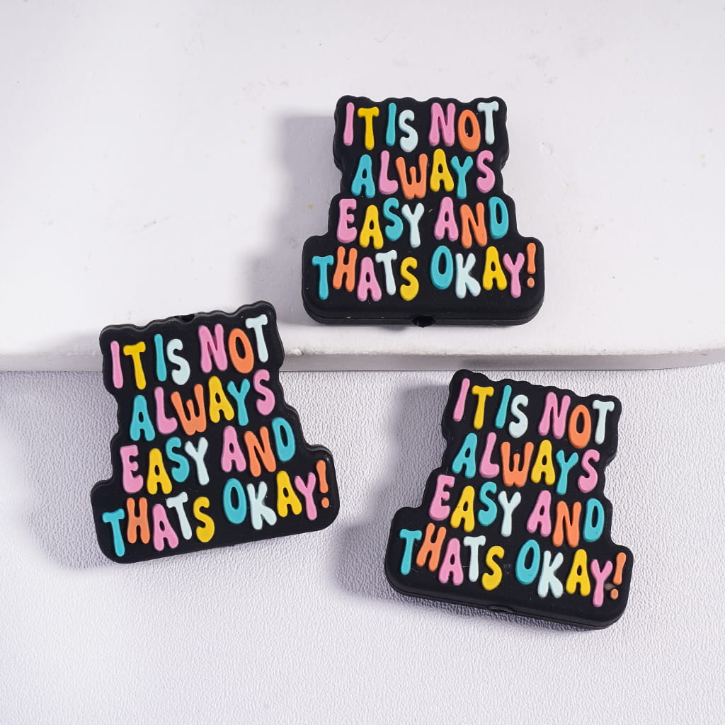 Black Background Silicone Focal Beads with Colorful Text “It’s Not Always Easy And That’s Okay!”