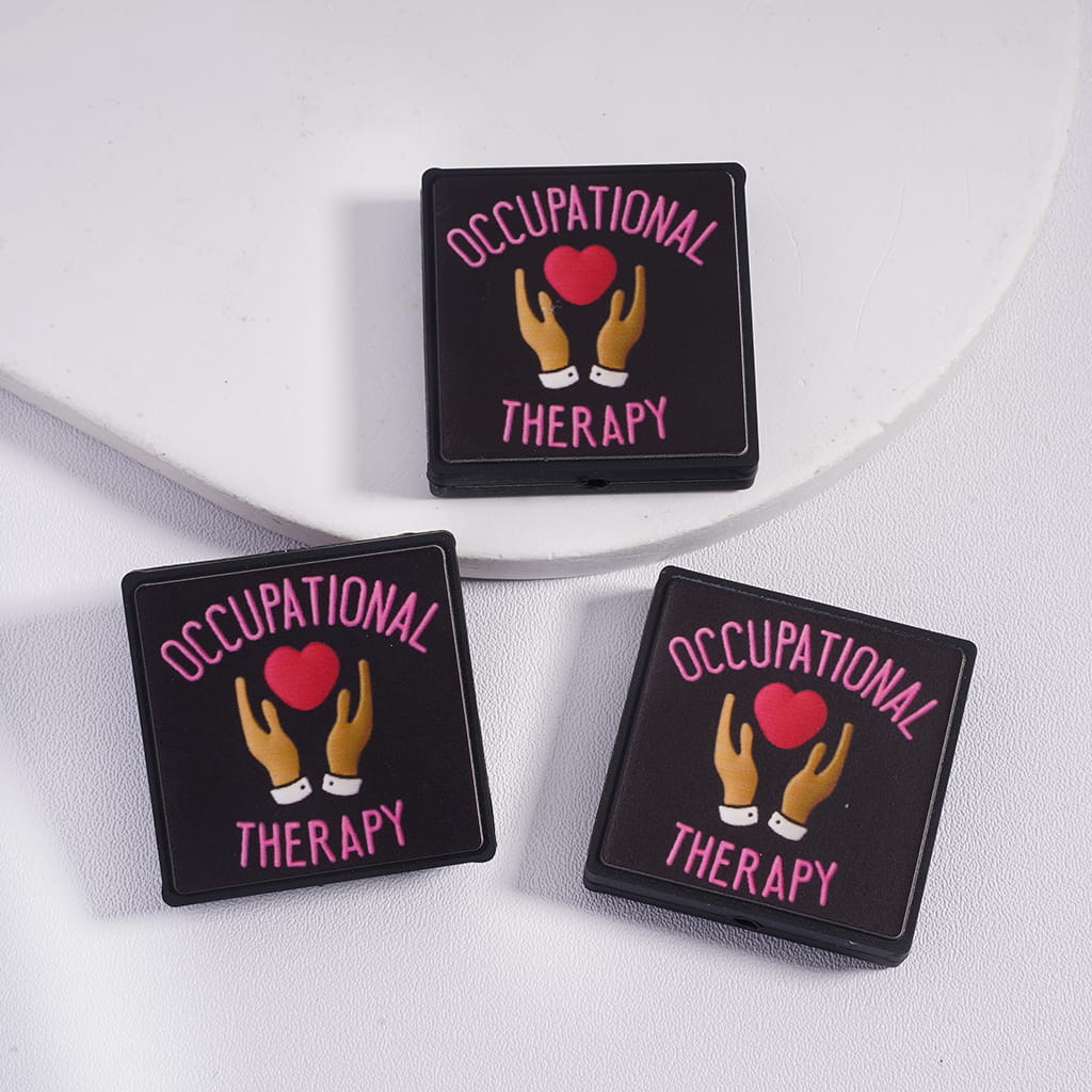 Flat Square Silicone Focal Beads with Pink Text “Occupational Therapy” with Red Heart Hand