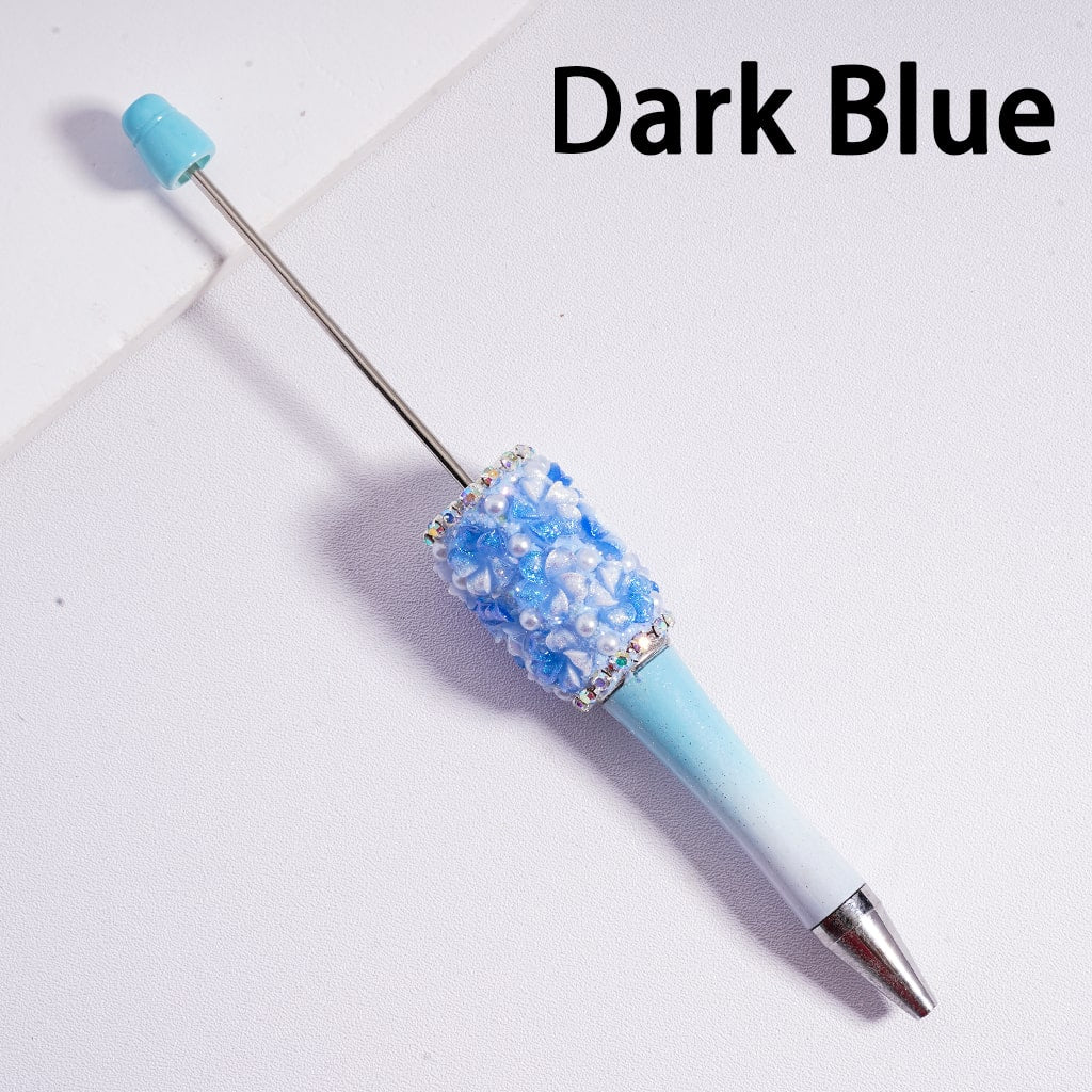 Decorative pen with dark blue and silver design on a white background