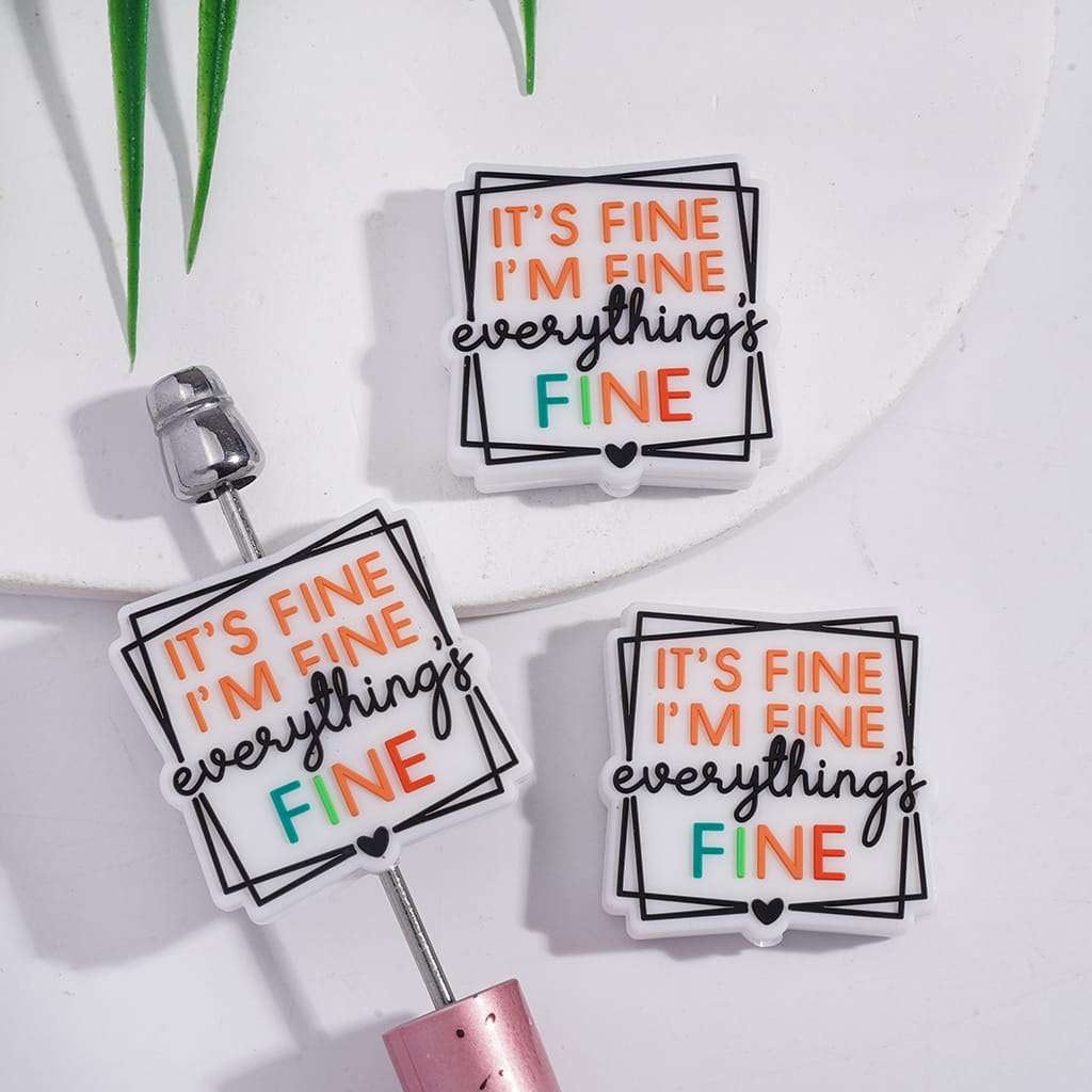 White Silicone Focal Beads in Two Frame Line with Text "IT'S FINE I'M FINE everything's FINE"