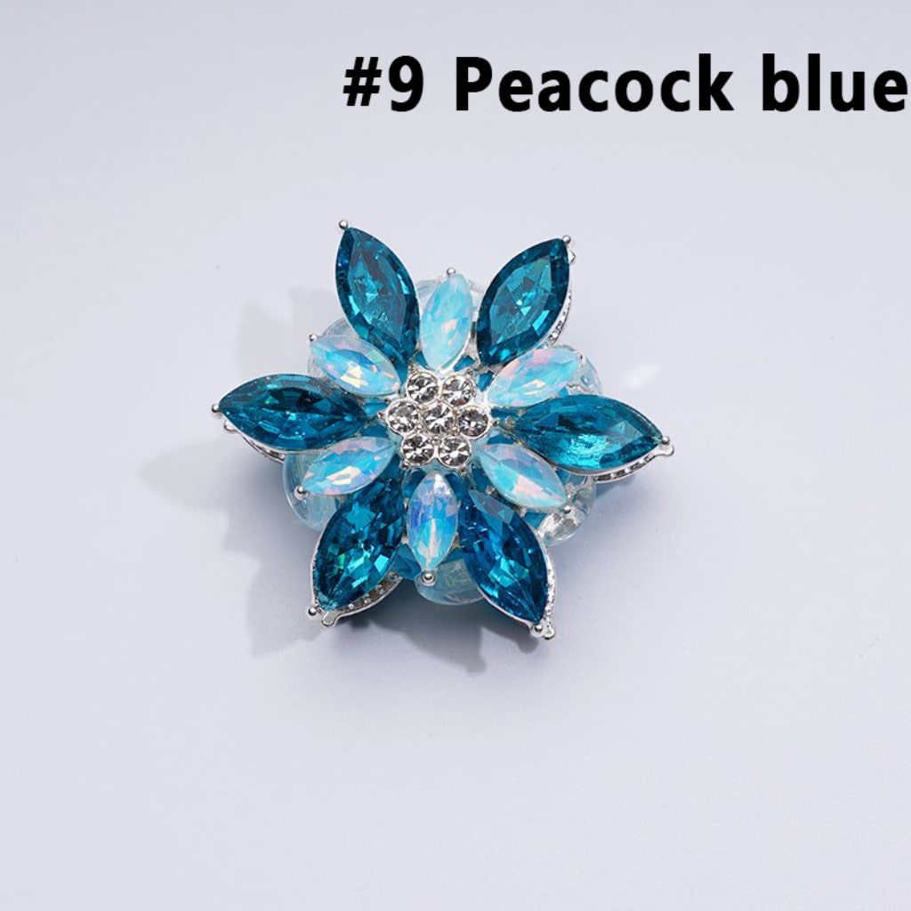 A collection of silver alloy six-petaled flowers with clear and colorful rhinestones and clay beads.