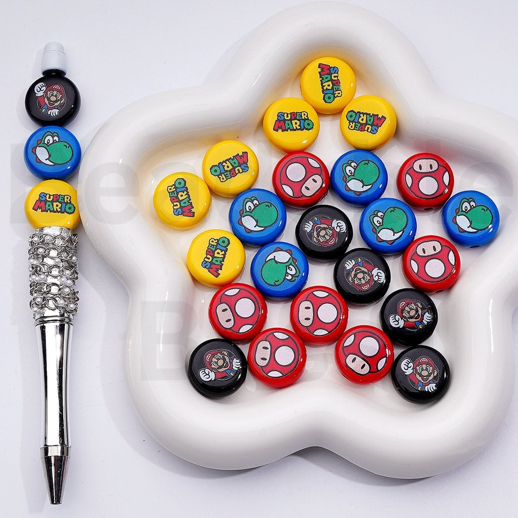 Collection of colorful mushroom-shaped buttons on a white dish with a pen.

