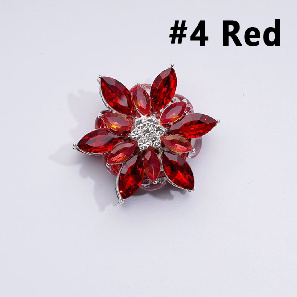 A collection of silver alloy six-petaled flowers with clear and colorful rhinestones and clay beads.

