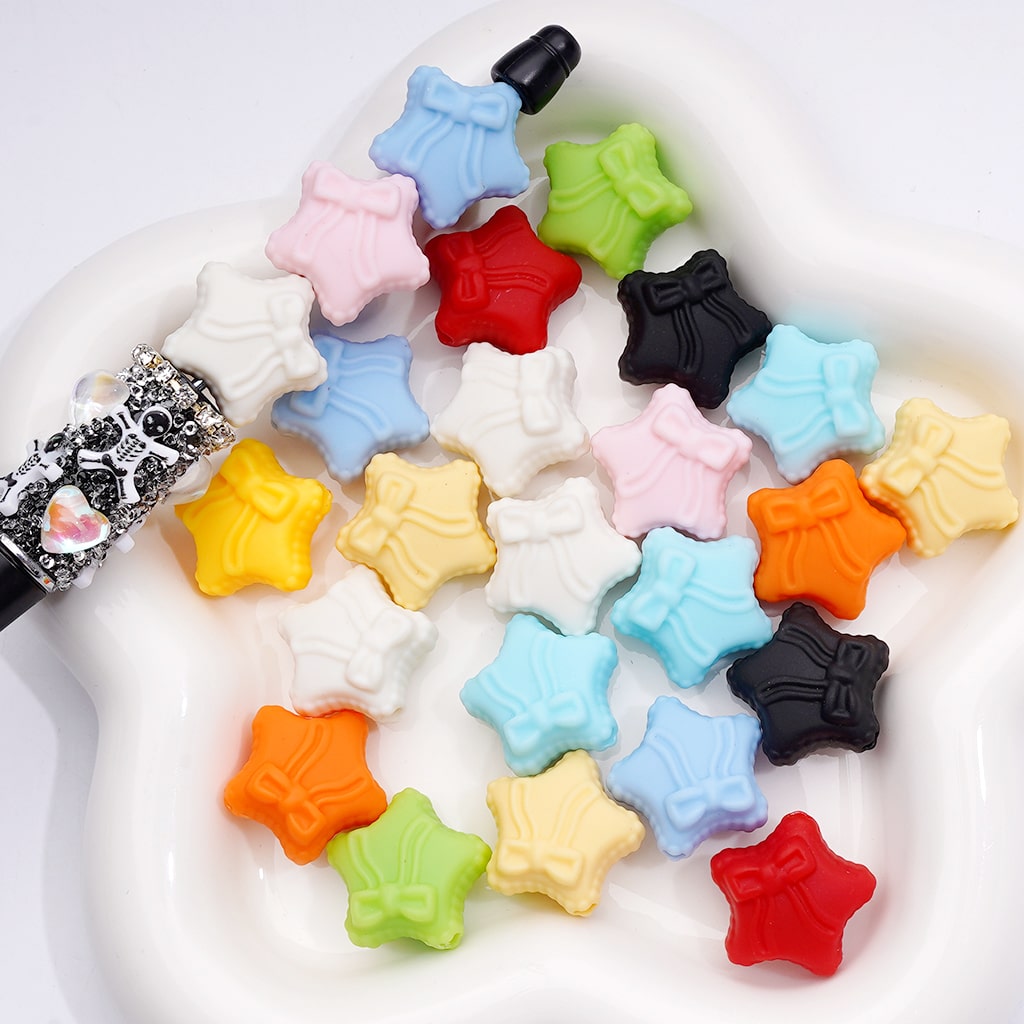 Colorful star-shaped beads on a white background


