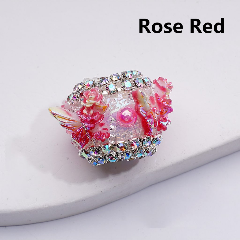 Decorative heart-shaped object with floral design and rhinestones on a white background, labeled 'Rose Red'.

