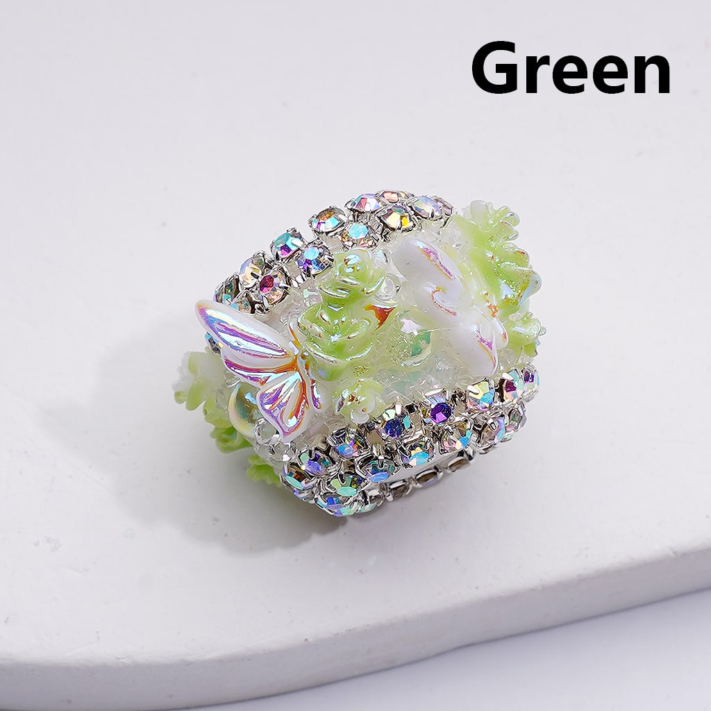 Decorative ring with gemstones on a white background, labeled 'Green'.

