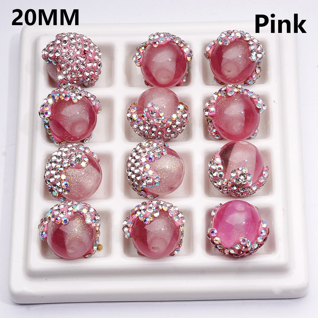 Pink earrings with rhinestones in a white display box, labeled '20MM Pink'.