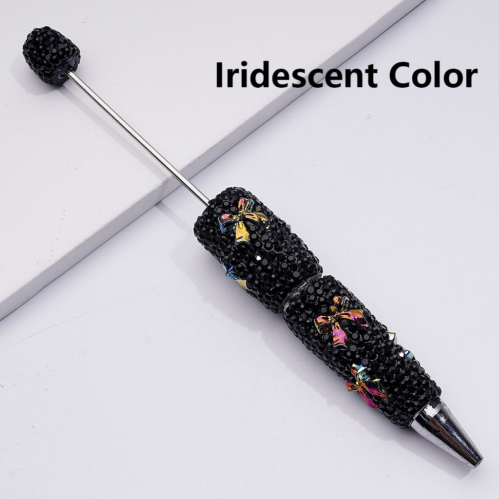 Black iridescent pen with decorative elements on a light gray background

