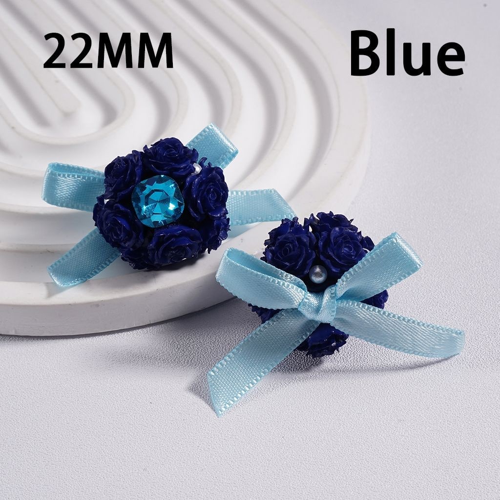 Blue flower corsage with ribbons on a white background

