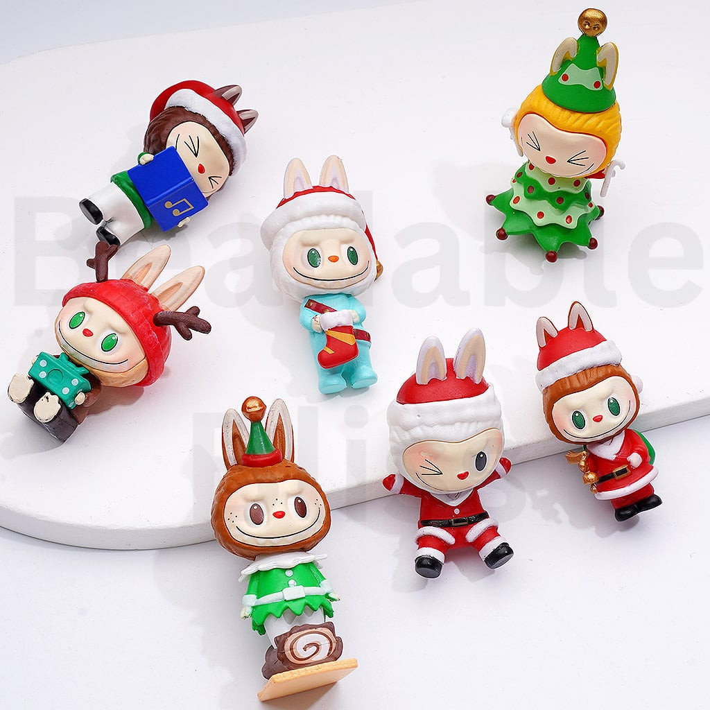 Set of Christmas-themed figurines on a white background

