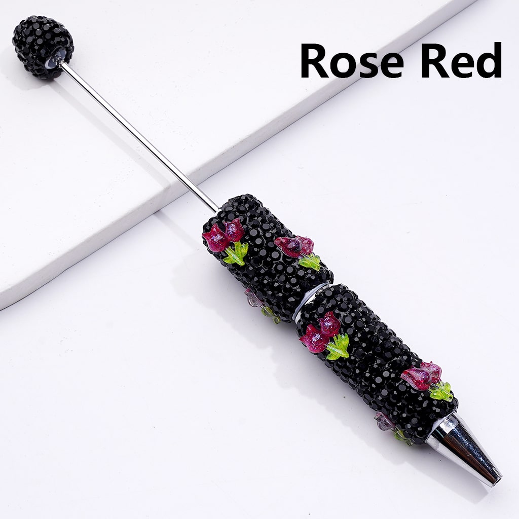 Decorative pen with rose red accents on a white background


