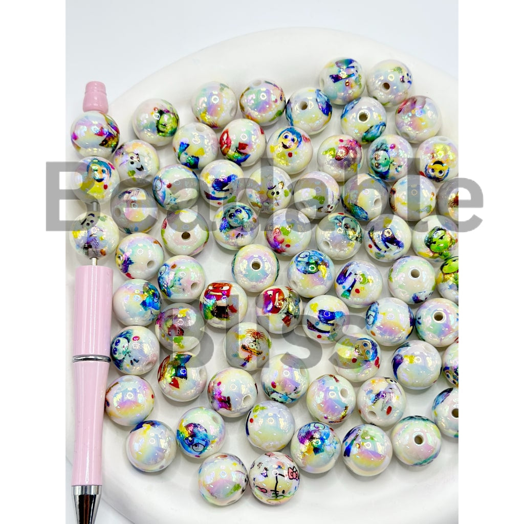 Colorful beads with a pink pen on a white background, featuring the brand 'Beads by'.

