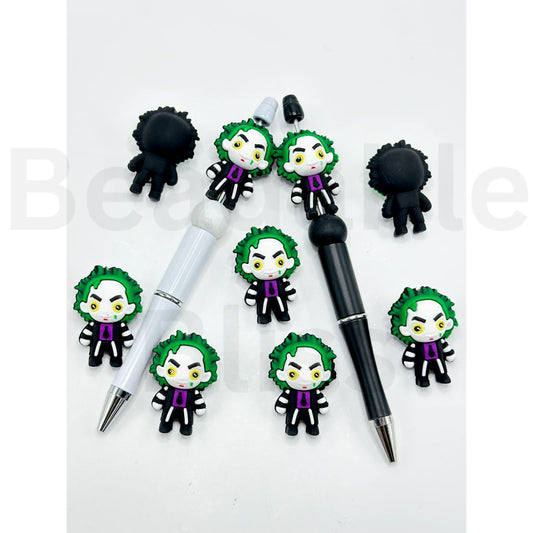 Two pens with Joker-themed pen toppers on a white background

