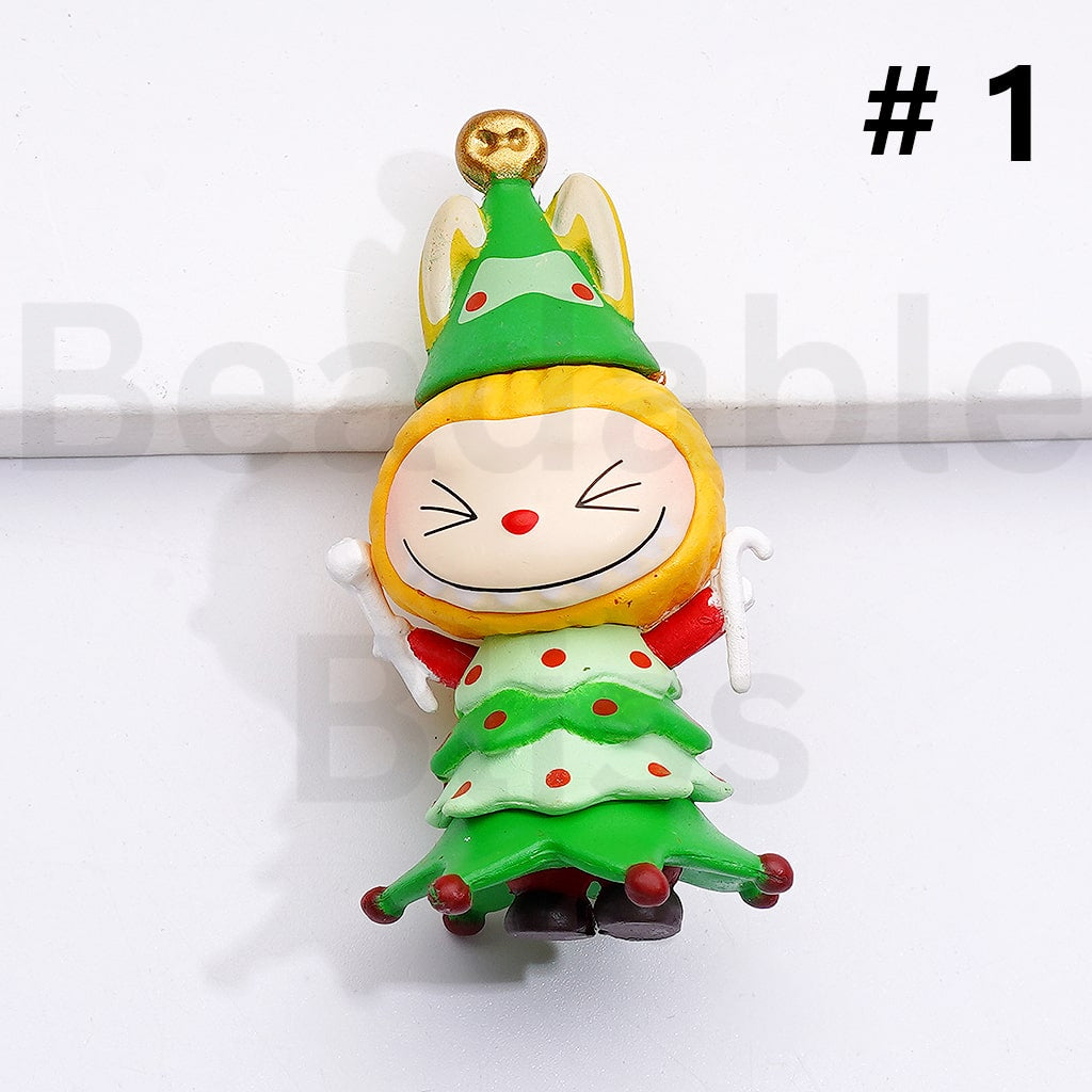 Colorful cartoon character figurine with a green hat and dress on a white background

