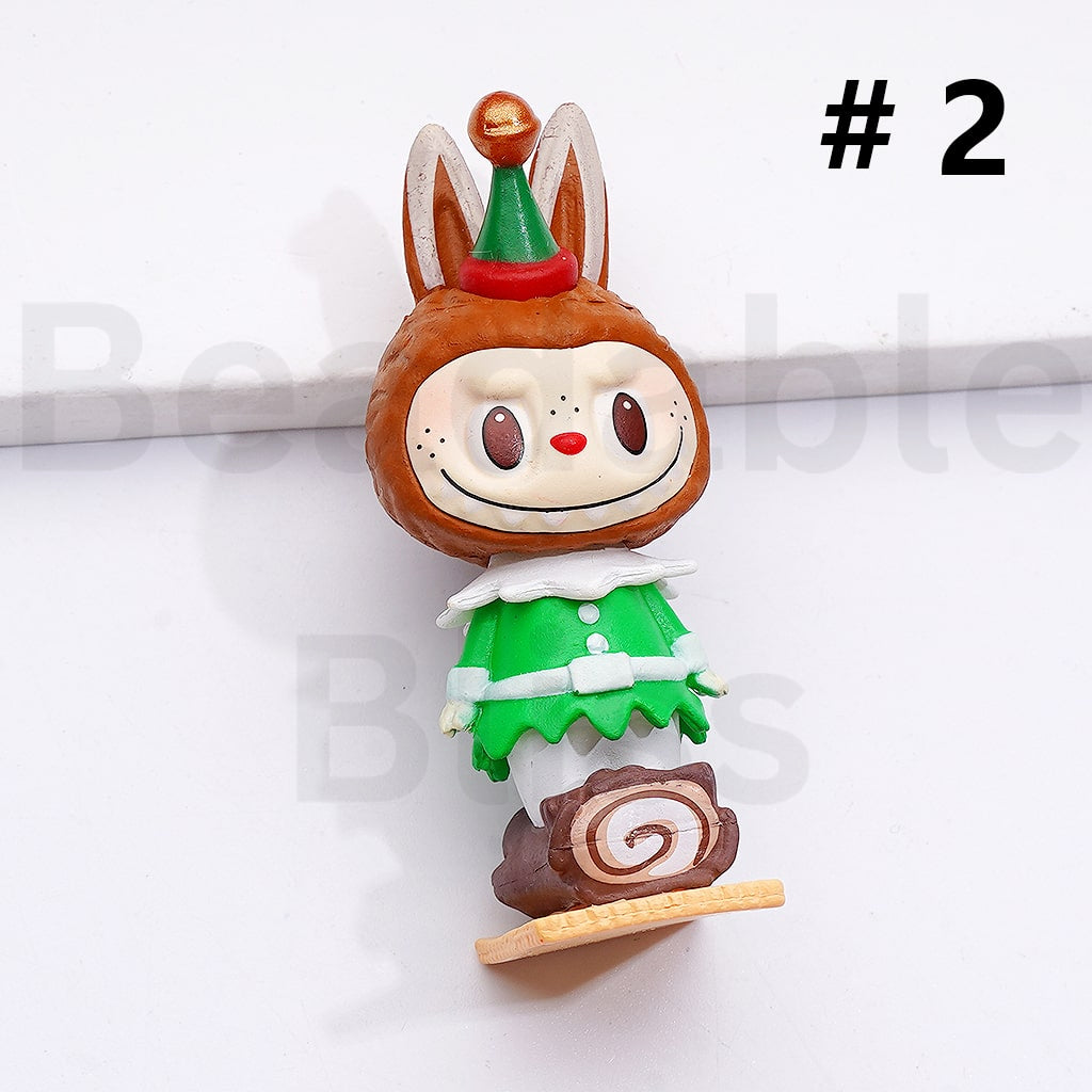 Toy figure of a character with a brown head, green outfit, and red hat on a white background.

