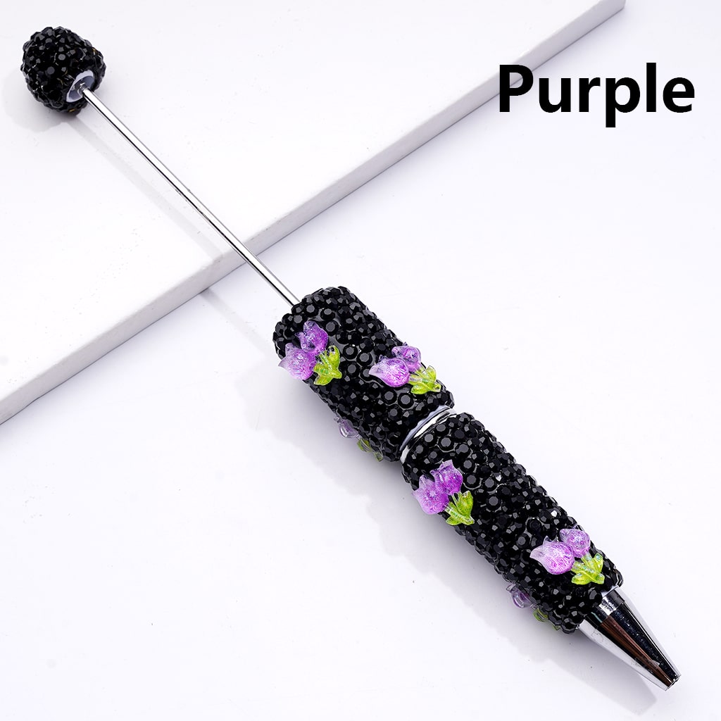 Decorative pen with purple accents on a white background

