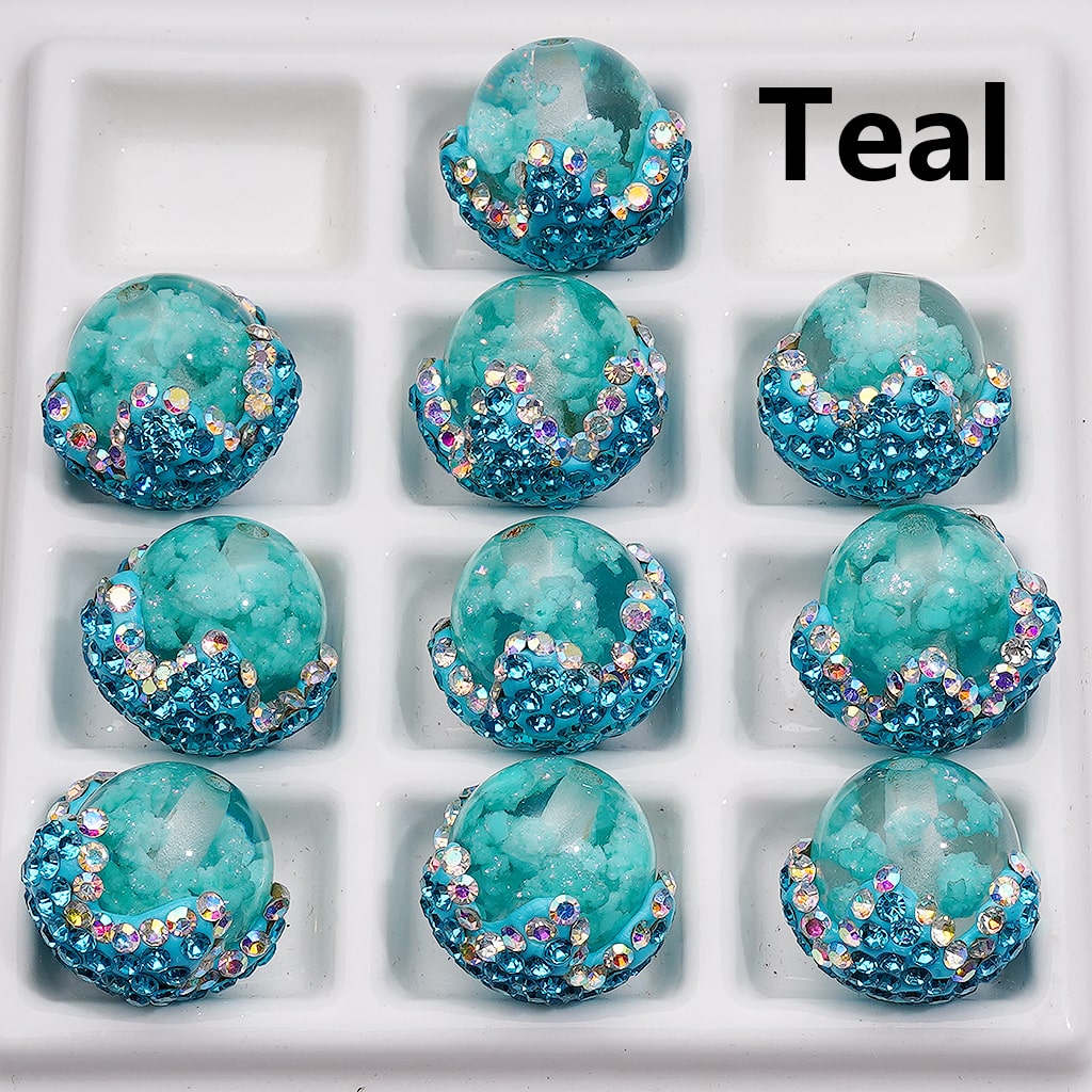 Teal decorative items with rhinestones arranged in a grid on a white background.

