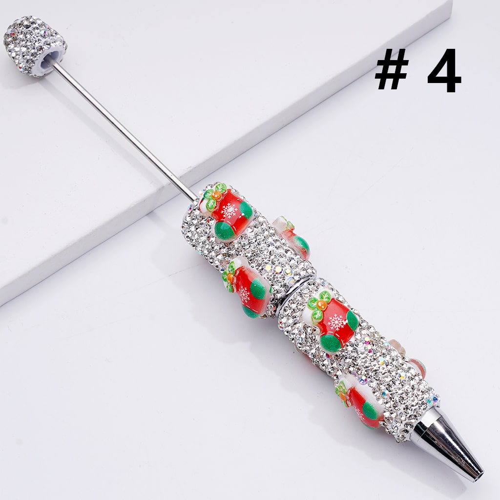 Decorative pen with gemstones on a white background

