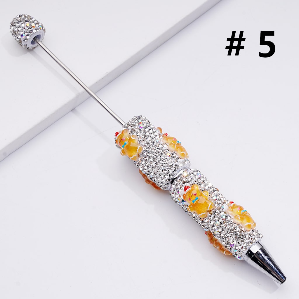 Decorative cocktail stirrer with gemstones on a white background

