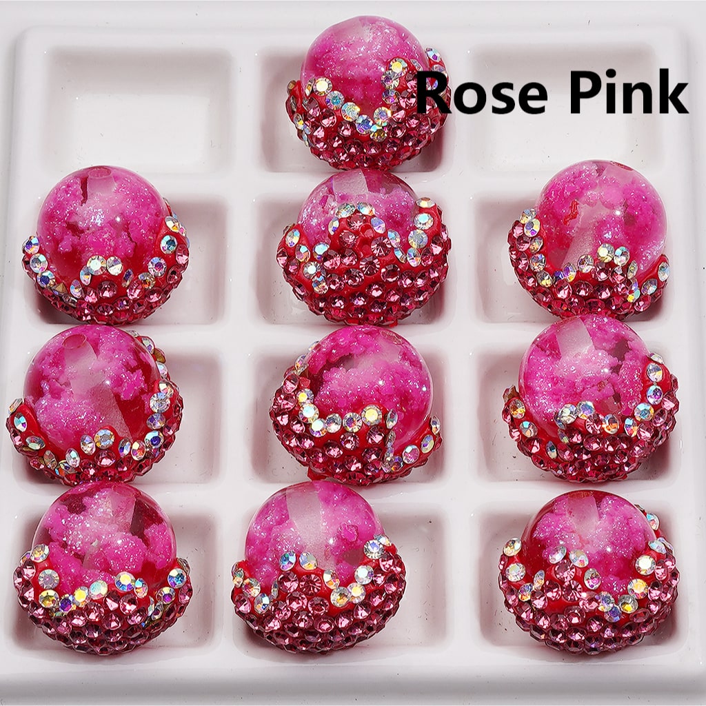 Rose Pink earrings with gemstones in a display box

