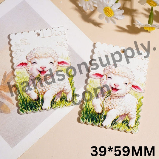 Cute Smiling Baby Lamb Eating Grass on Lawn Wavy Edged Flat Rectangle Acrylic Pendants, 39*59MM