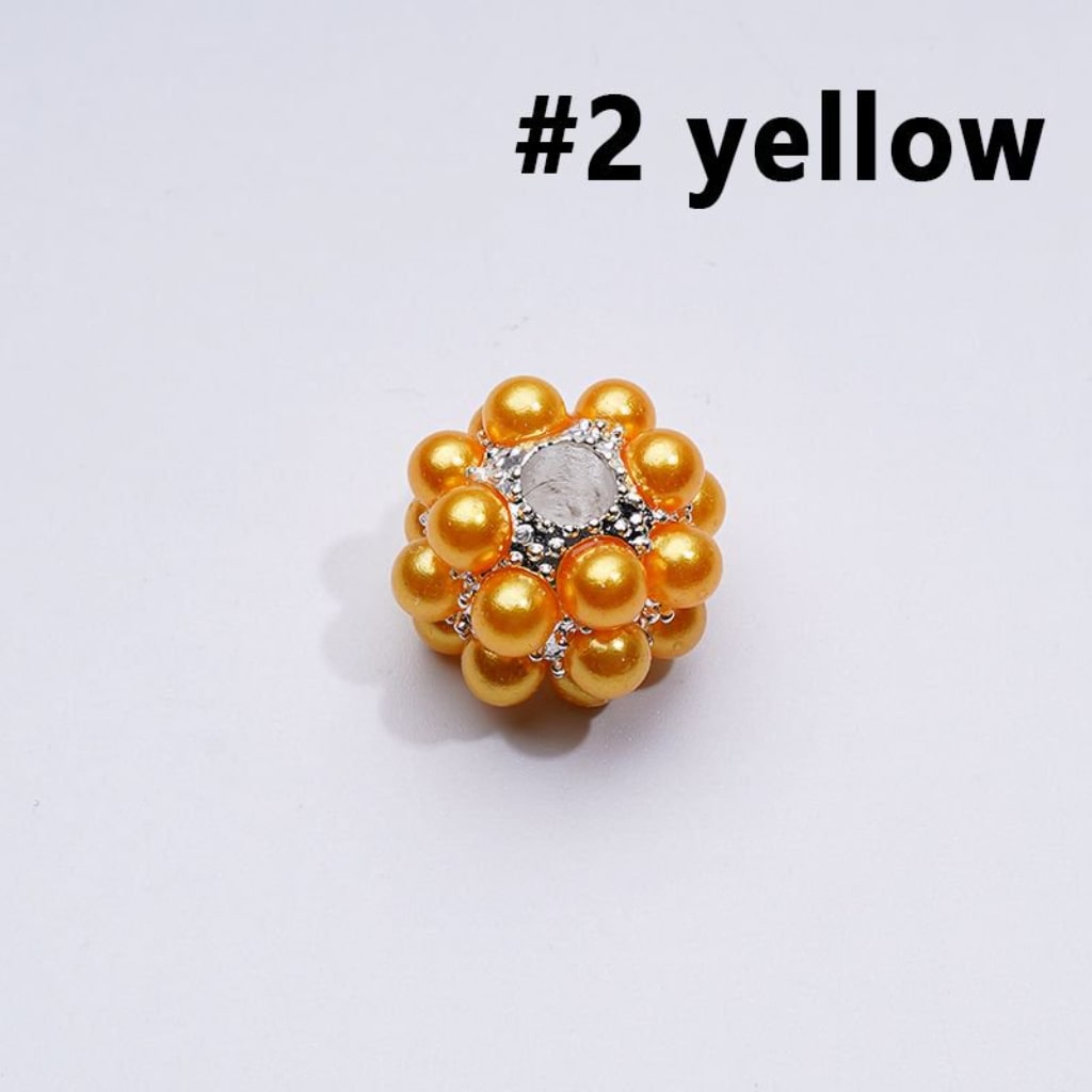 Gold beaded ring with a central stone on a white background, labeled '#2 yellow'.

