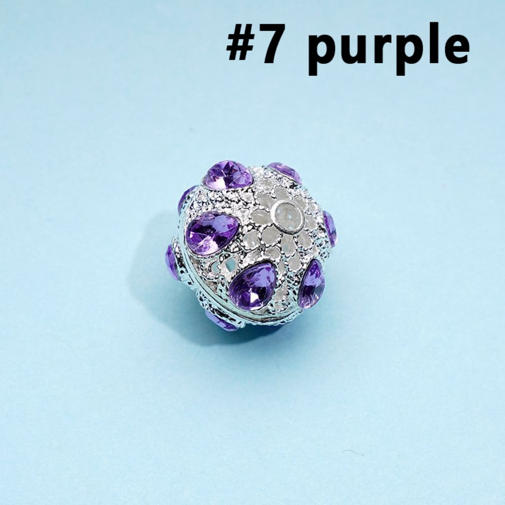 A collection of silver alloy beads with colorful rhinestones, approximately 16mm in size, displayed on a blue background.

