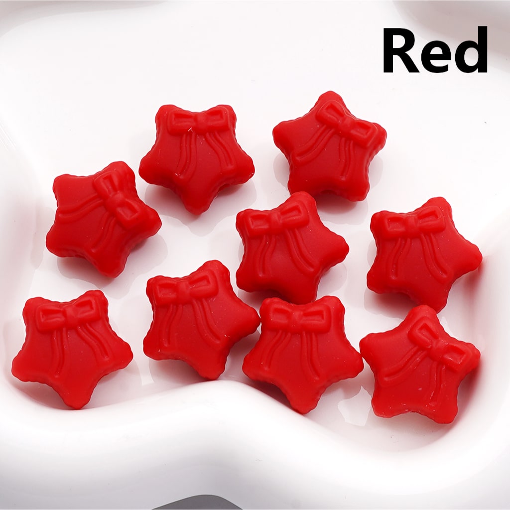 Red star-shaped objects with bows on a white background

