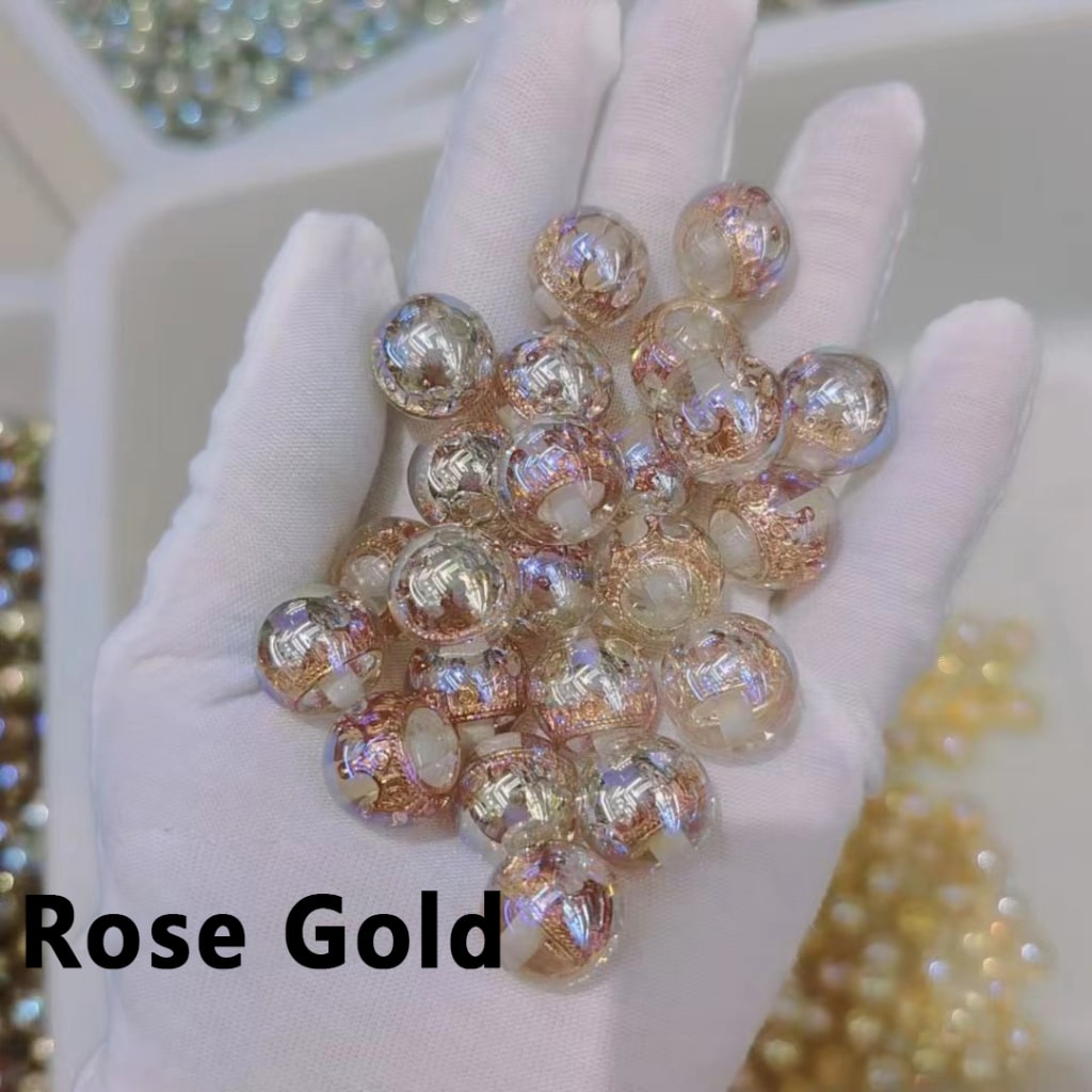 Hand holding rose gold beads with 'Rose Gold' text overlay

