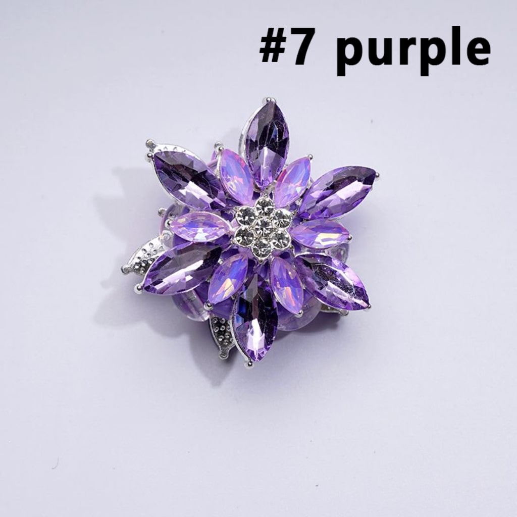 A collection of silver alloy six-petaled flowers with clear and colorful rhinestones and clay beads.

