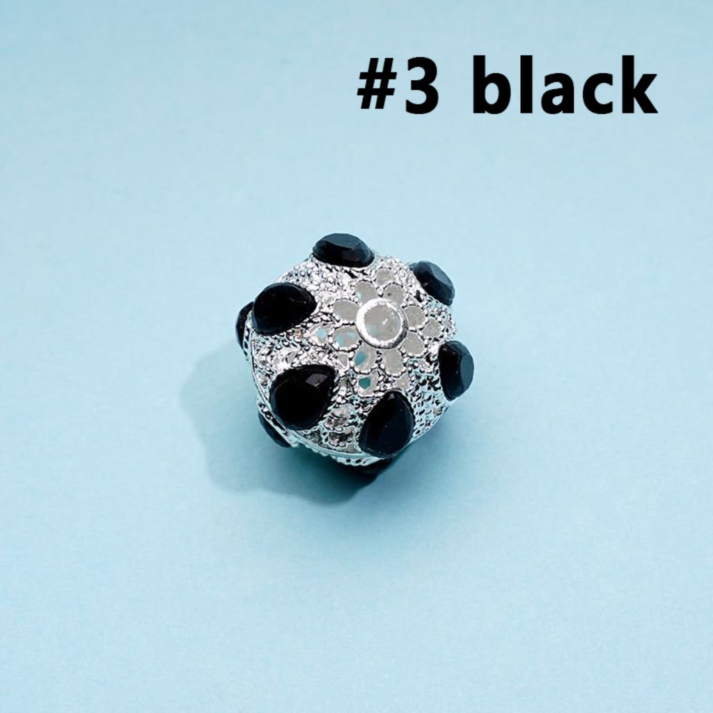 A collection of silver alloy beads with colorful rhinestones, approximately 16mm in size, displayed on a blue background.

