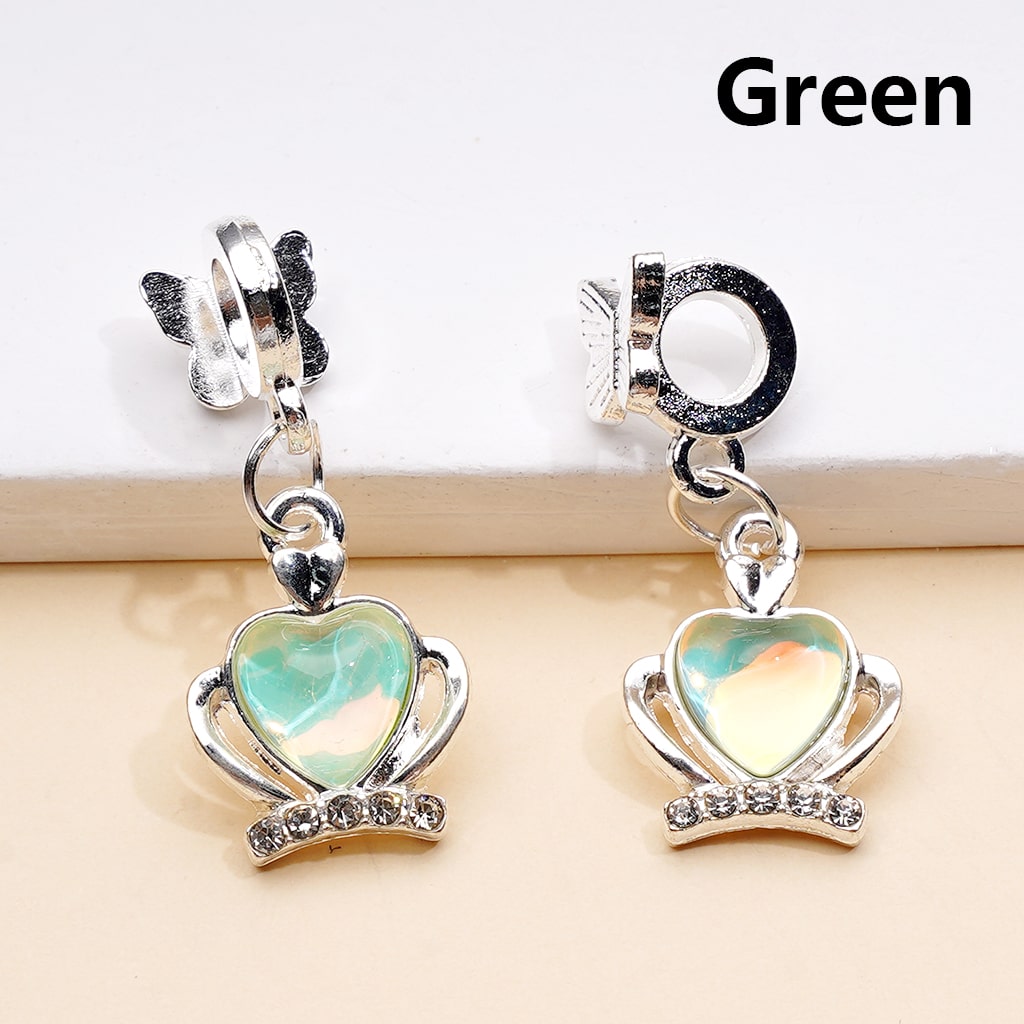 Heart-shaped earrings with green and multicolor heart design on a white background

