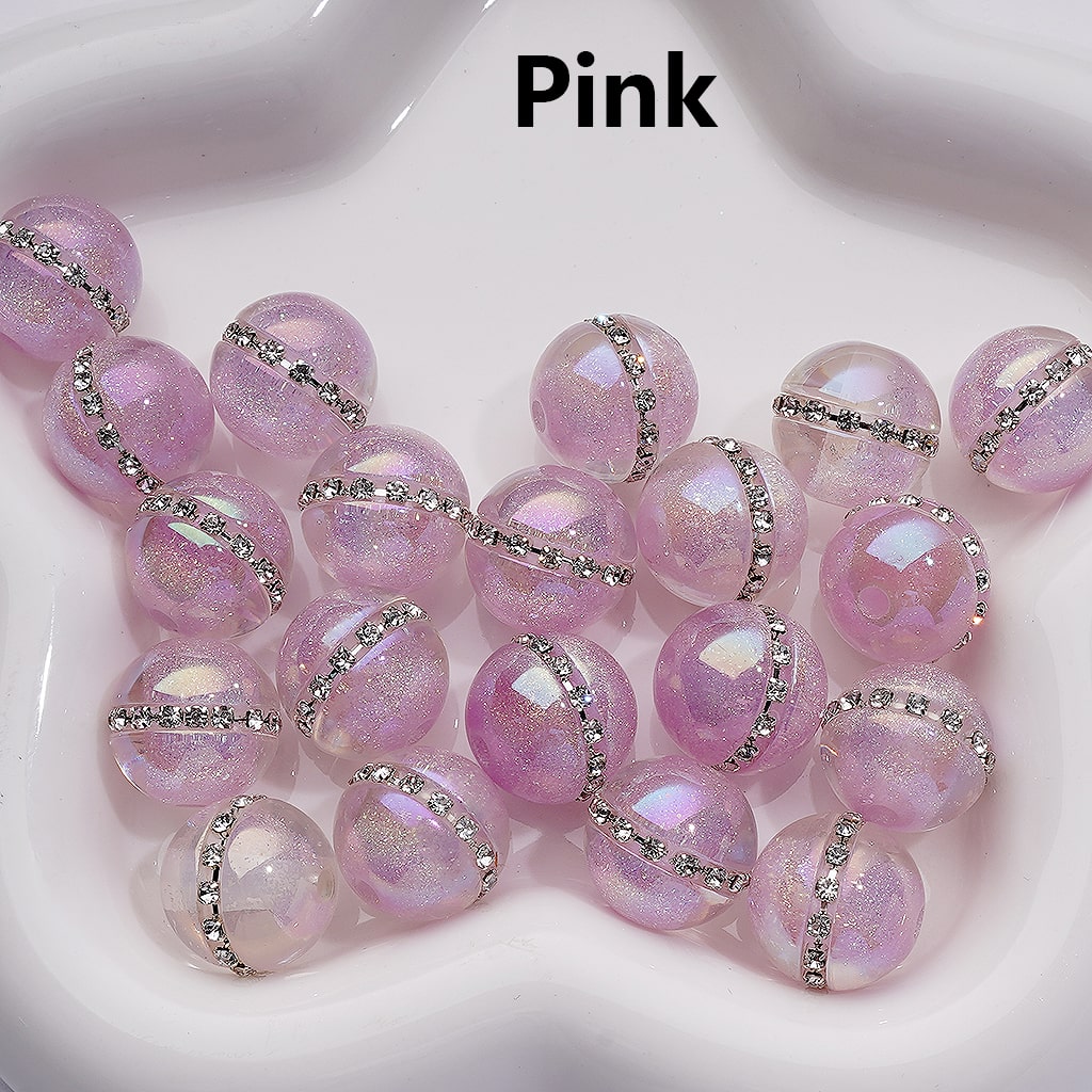 Pink beads with silver accents on a white background

