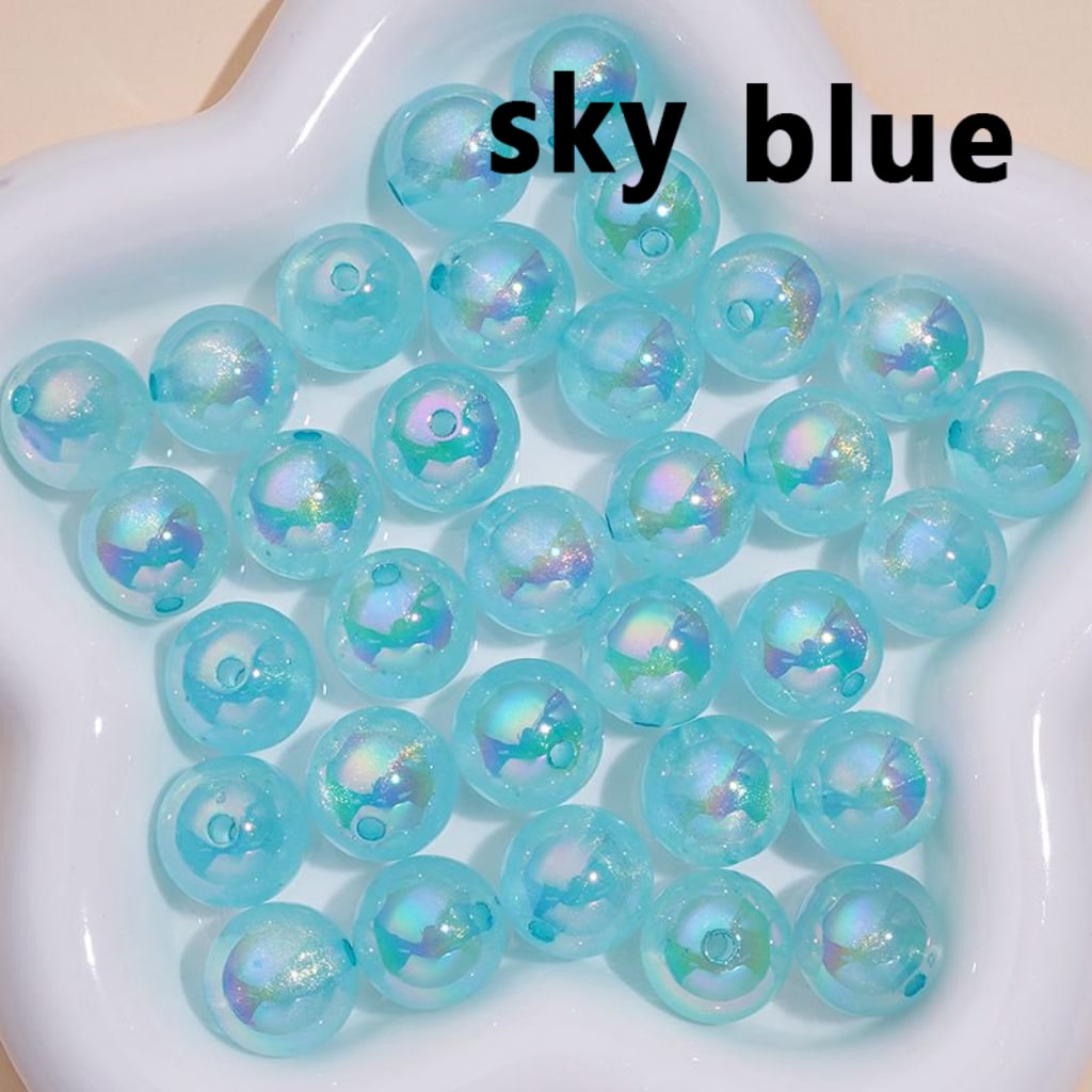Sky blue gel beads on a white plate with 'sky blue' text.

