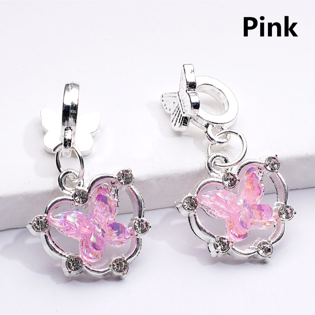Pink butterfly earrings with silver hooks on a white background

