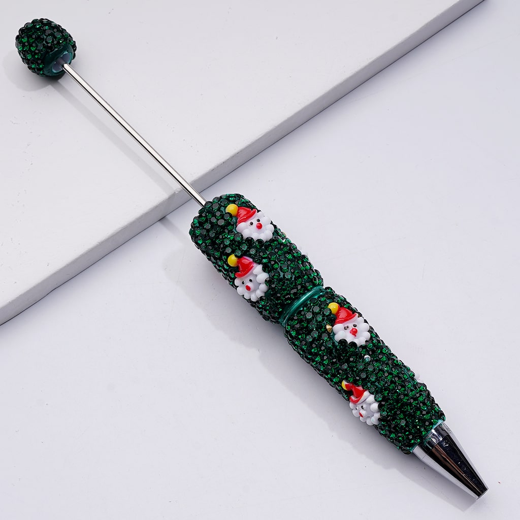 Decorative pen with snowman design on a white background

