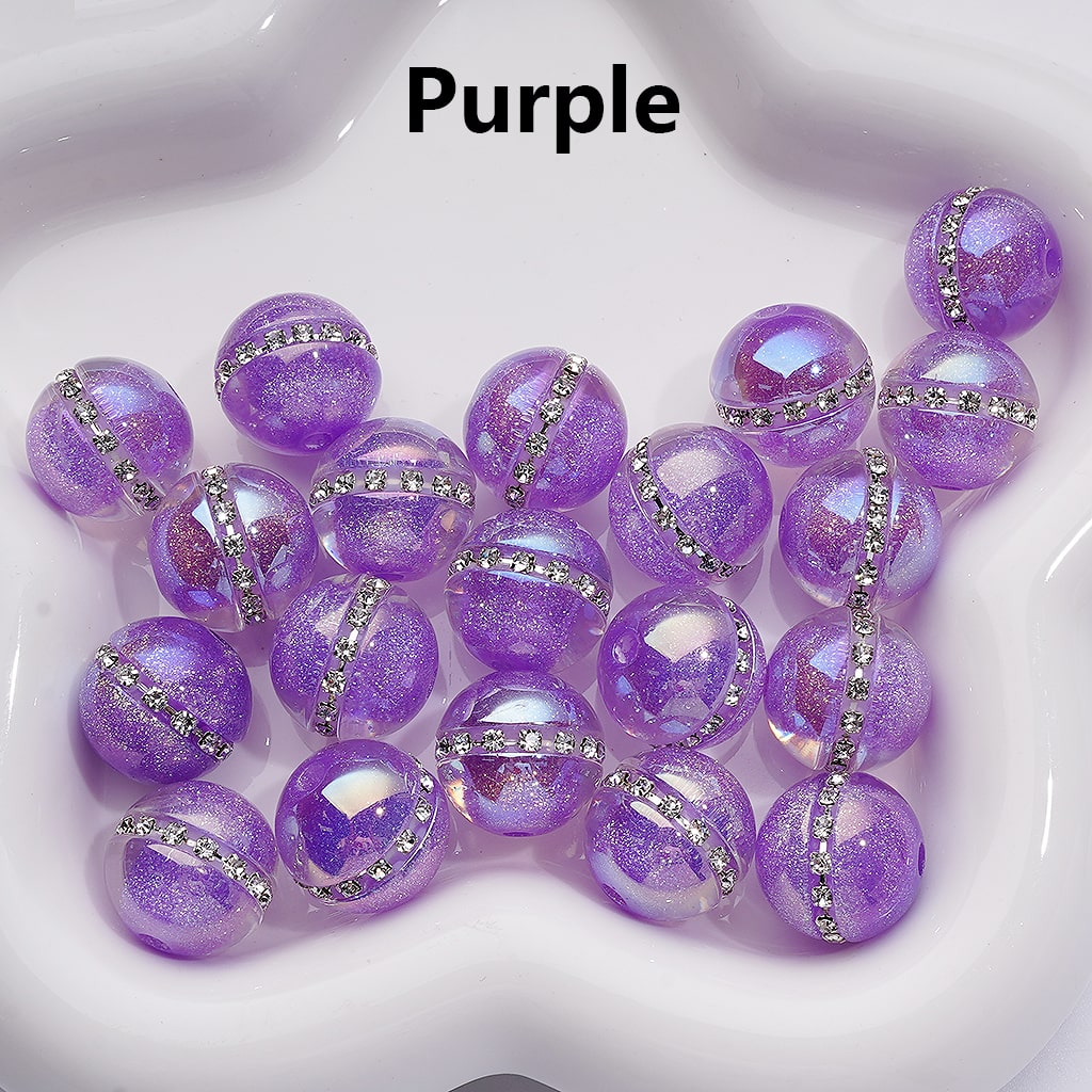 Purple beads with silver accents on a white background

