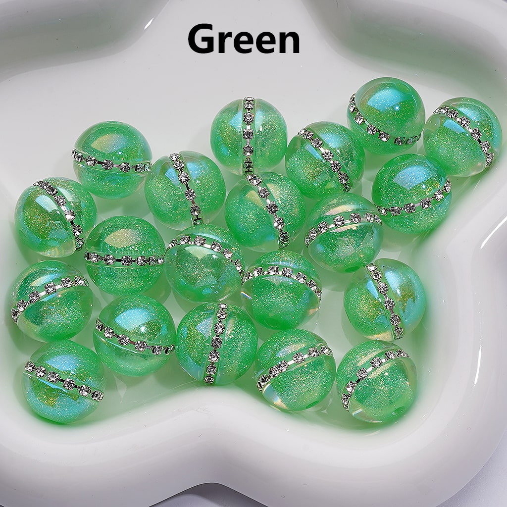 Green beads with decorative ribbons on a white surface

