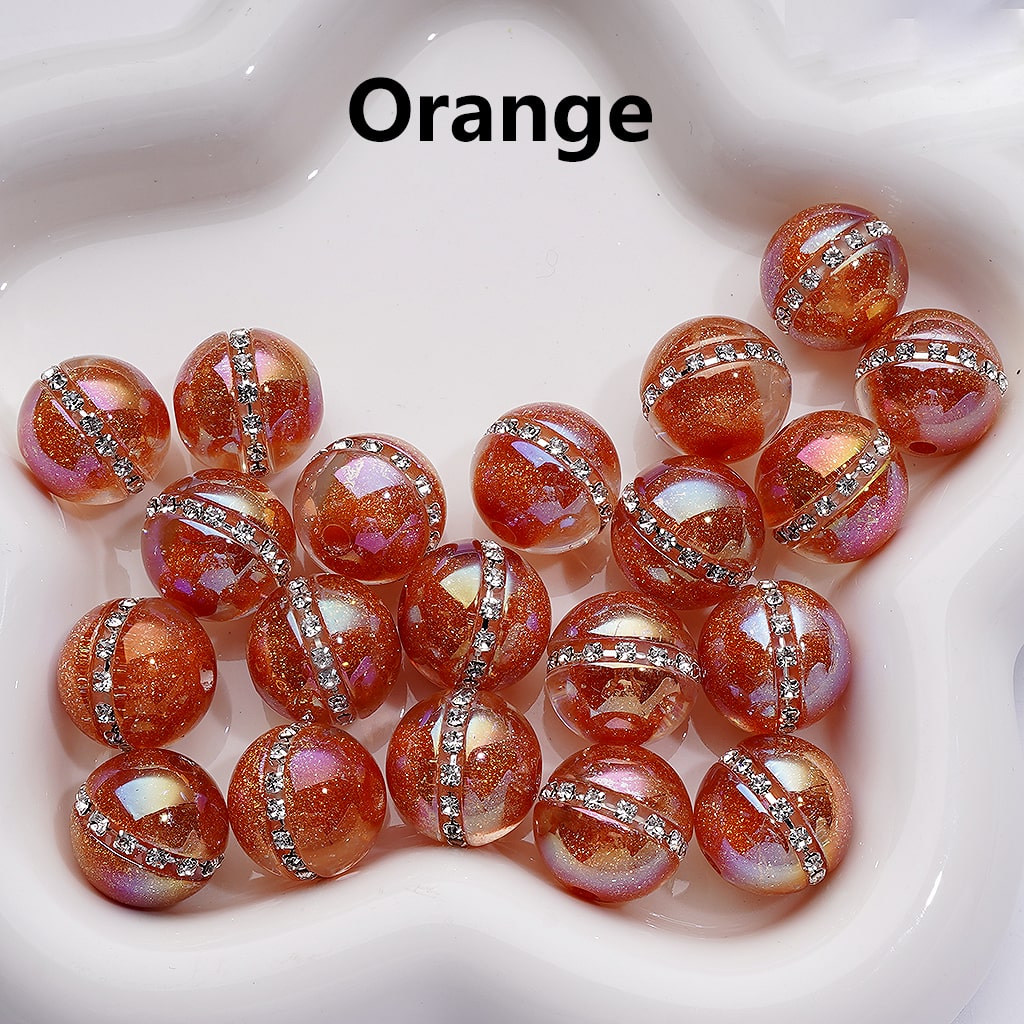 Orange beads with silver accents on a white background

