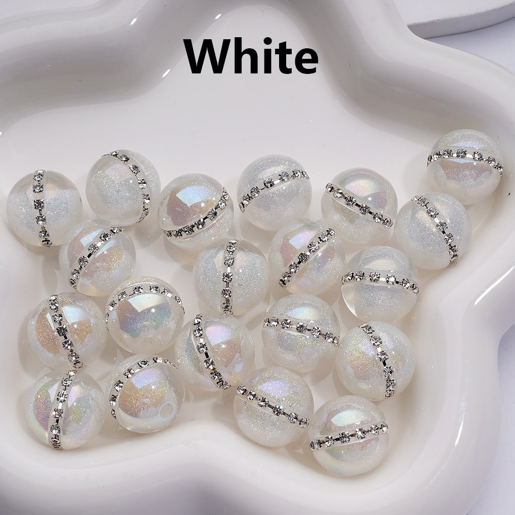 White pearls with silver accents on a white background

