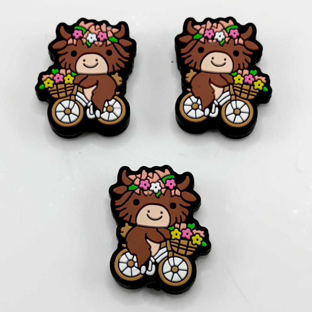 Brown Little Cute Cow Rides a Bike with Small Flowers Silicone Focal Beads