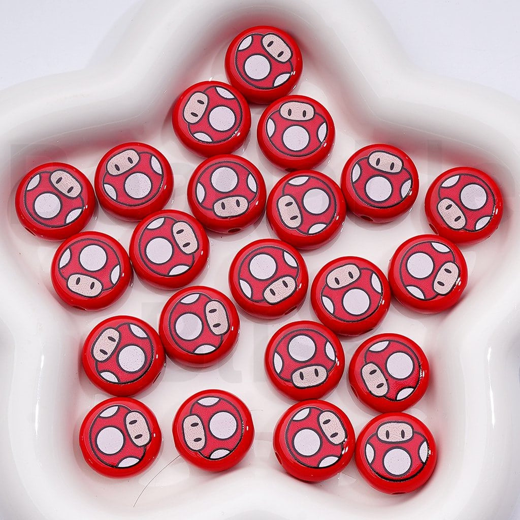 Red mushroom-shaped buttons with white spots on a white surface

